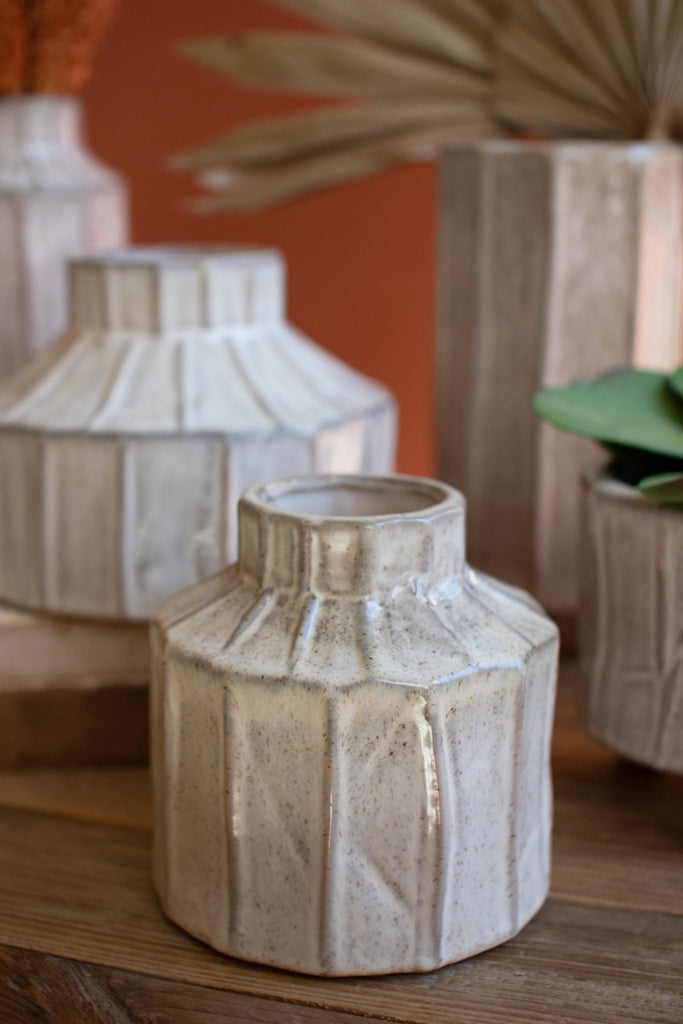 SET OF FIVE WHITE CERAMIC PLANTERS