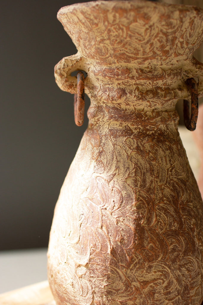 TALL ANTIQUED CLAY URN WITH METAL RINGS